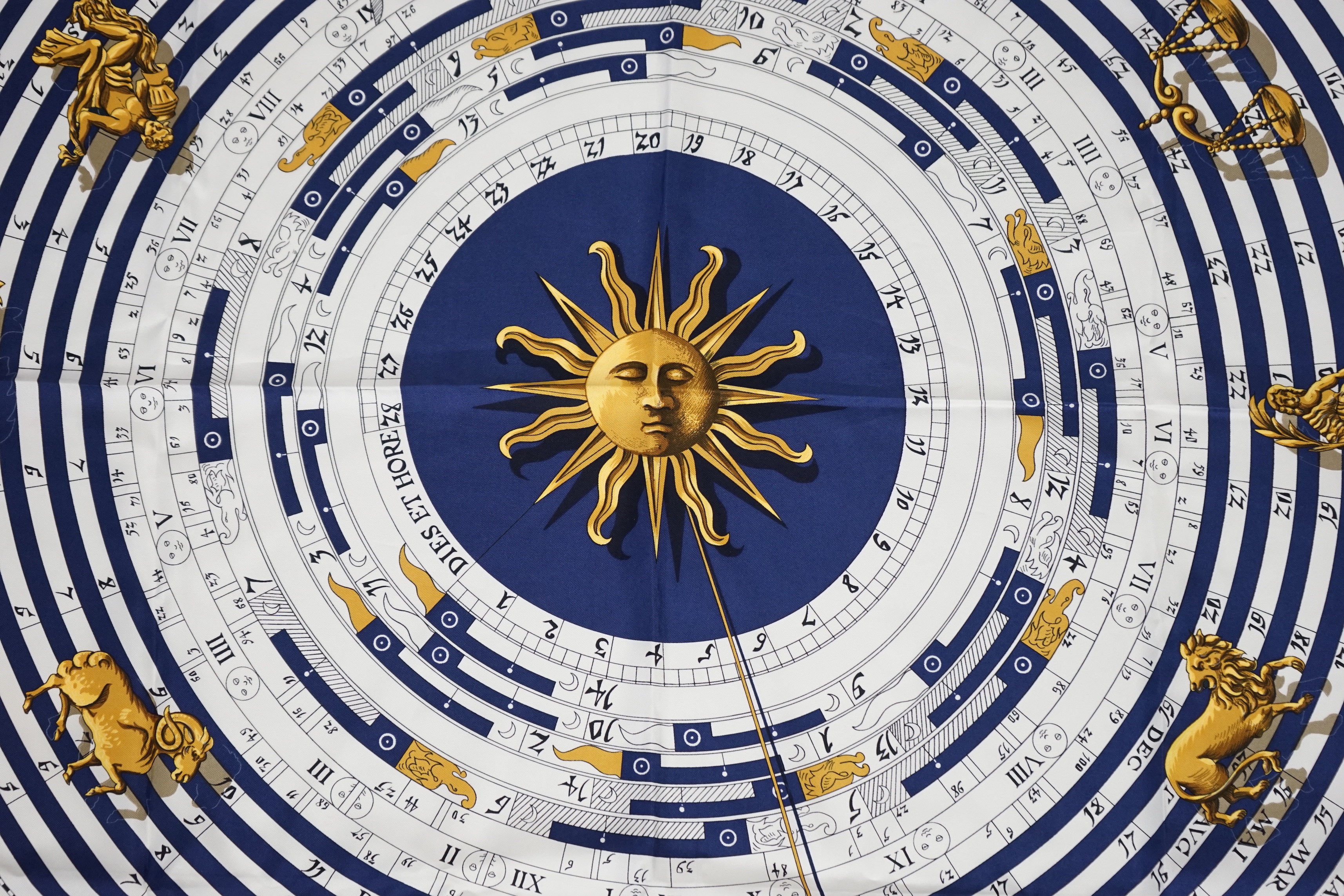 A Hermès Dies et Hore navy silk scarf, 90cm x 90cm